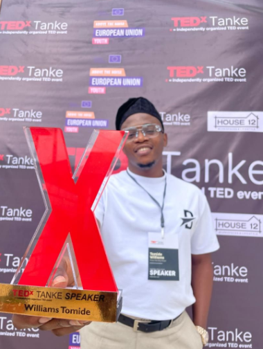 Holding official TEDx Speaker Award plaque at TEDx Tanke